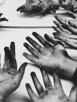 Hands covered with charcoal